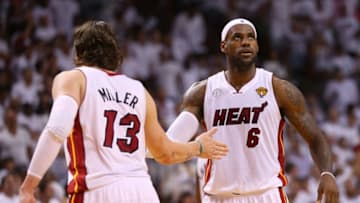 LeBron James #6 and Mike Miller #13 of the Miami Heat celebrate in the second quarter while taking on the San Antonio Spurs during Game Seven of the 2013 NBA Finals (Photo by Mike Ehrmann/Getty Images)