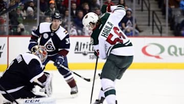 Mar 26, 2016; Denver, CO, USA; Minnesota Wild left wing Erik Haula (56) attempts to score on Colorado Avalanche goalie Semyon Varlamov (1) in the third period at the Pepsi Center. The Wild defeated the Avalanche 4-0. Mandatory Credit: Ron Chenoy-USA TODAY Sports