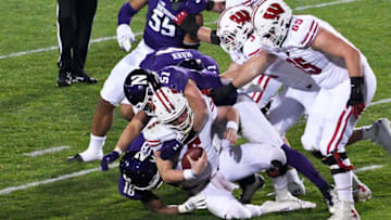 Nov 21, 2020; Evanston, Illinois, USA; Northwestern Wildcats linebacker Blake Gallagher (51) sacks Wisconsin Badgers quarterback Graham Mertz (5) during the second half at Ryan Field. Mandatory Credit: David Banks-USA TODAY Sports