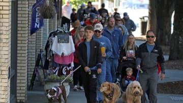 Over a hundred people and pets take part in the pet parade Saturday morning during the 2023 Mush, Music & Mutts Festival in Uptown Shelby.