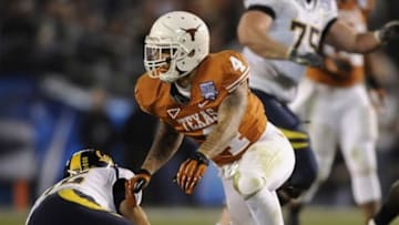December 28, 2011; San Diego, CA, USA; Texas Longhorns safety Kenny Vaccaro (4) reacts after sacking California Golden Bears quarterback Zach Maynard (15) during the second quarter in the Holiday Bowl at Qualcomm Stadium. Mandatory Credit: Christopher Hanewinckel-USA TODAY Sports