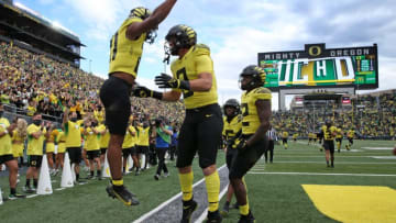 Oregon's Byron Cardwell, left, celebrates his touch down against Colorado during the first quarter Saturday Oct. 30, 2021.Eug 103021 Uo Cofb09