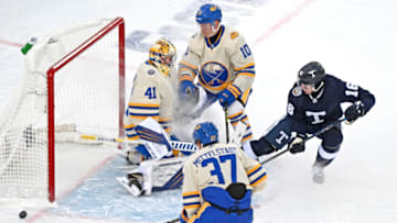 Mar 13, 2022; Hamilton, Ontario, CAN; Buffalo Sabres goalie Craig Anderson (41) makes a save on Toronto Maple Leafs forward Mitch Marner (16) in the second period of the 2022 Heritage Classic ice hockey game at Tim Hortons Field. Mandatory Credit: Dan Hamilton-USA TODAY Sports