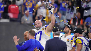 Feb 13, 2022; Inglewood, California, USA; Los Angeles Rams offensive tackle Andrew Whitworth (77) holds the Vince Lombardi Trophy after the Rams defeated the Cincinnati Bengals in Super Bowl LVI at SoFi Stadium. Mandatory Credit: Kirby Lee-USA TODAY Sports