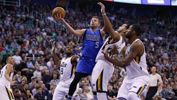 Nov 2, 2016; Salt Lake City, UT, USA; Utah Jazz guard Rodney Hood (5) drives to the hoop against Utah Jazz guard Shelvin Mack (8), forward Trey Lyles (41) and forward Derrick Favors (15) in the second quarter at Vivint Smart Home Arena. Mandatory Credit: Jeff Swinger-USA TODAY Sports