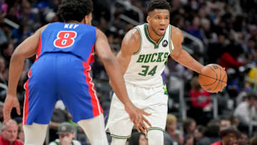 Antetokounmpo #34 of the Milwaukee Bucks handles the ball against Braxton Key #8 of the Detroit Pistons (Photo by Nic Antaya/Getty Images)