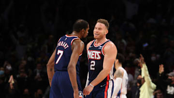 NEW YORK, NEW YORK - DECEMBER 16: Kevin Durant #7 and Blake Griffin #2 of the Brooklyn Nets celebrate a three pointer by Griffen against the Philadelphia 76ers during their game at Barclays Center on December 16, 2021 in New York City. NOTE TO USER: User expressly acknowledges and agrees that, by downloading and or using this photograph, User is consenting to the terms and conditions of the Getty Images License Agreement. (Photo by Al Bello/Getty Images)