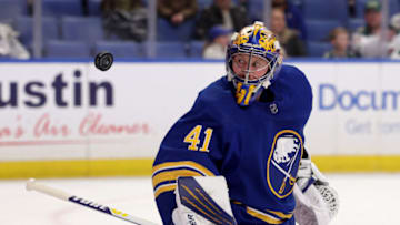 Mar 4, 2022; Buffalo, New York, USA; Buffalo Sabres goaltender Craig Anderson (41) makes a save and looks for the puck during the first period against the Minnesota Wild at KeyBank Center. Mandatory Credit: Timothy T. Ludwig-USA TODAY Sports