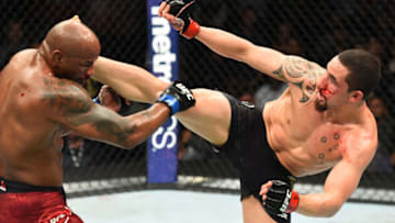 CHICAGO, ILLINOIS - JUNE 09: (R-L) Robert Whittaker of New Zealand lands a kick to the head of Yoel Romero of Cuba in their middleweight fight during the UFC 225 event at the United Center on June 9, 2018 in Chicago, Illinois. (Photo by Josh Hedges/Zuffa LLC/Zuffa LLC via Getty Images)