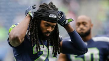 SEATTLE, WA - SEPTEMBER 17: Cornerback Richard Sherman #25 of the Seattle Seahawks adjusts his head band during warm ups before a game against the San Francisco 49ers at CenturyLink Field on September 17, 2017 in Seattle, Washington. The Seahawks won the game 12-9. (Photo by Stephen Brashear/Getty Images)