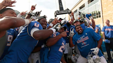 TULSA, OK - DECEMBER 1: Members of the Tulsa Golden Hurrican pose for photos after the C-USA championship game against the Central Florida Knights on December 1, 2012 at H.A. Chapman Stadium in Tulsa, Oklahoma. Tulsa defeated Central Florida 33-27 in overtime. (Photo by Brett Deering/Getty Images)
