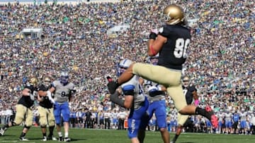 Oct 8, 2011; South Bend, IN, USA; Notre Dame Fighting Irish tight end Tyler Eifert (80) catches the ball in the end zone for a touchdown against the Air Force Falcons at Notre Dame Stadium. Mandatory Credit: Brian Spurlock-USA TODAY Sports