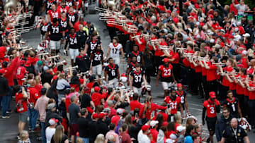 The Georgia football team enters Sanford Stadium during the Dawg Walk before the start of the G-Day spring football game in Athens, Ga., on Saturday, April 16, 2022.News Joshua L Jones