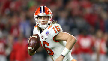GLENDALE, ARIZONA - DECEMBER 28: Trevor Lawrence #16 of the Clemson Tigers looks to pass against the Ohio State Buckeyes in the second half during the College Football Playoff Semifinal at the PlayStation Fiesta Bowl at State Farm Stadium on December 28, 2019 in Glendale, Arizona. (Photo by Matthew Stockman/Getty Images)