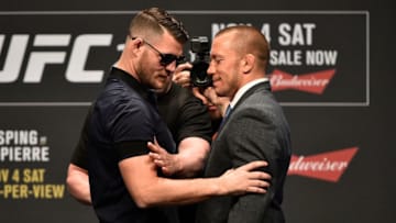 LAS VEGAS, NV - OCTOBER 06: (L-R) Opponents Michael Bisping and Georges St-Pierre face off during the UFC 217 news conference inside T-Mobile Arena on October 6, 2017 in Las Vegas, Nevada. (Photo by Jeff Bottari/Zuffa LLC/Zuffa LLC via Getty Images)