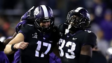 FORT WORTH, TEXAS - NOVEMBER 24: Grayson Muehlstein #17 of the TCU Horned Frogs and Sewo Olonilua #33 celebrate a touchdown against the Oklahoma State Cowboys at Amon G. Carter Stadium on November 24, 2018 in Fort Worth, Texas. (Photo by Ronald Martinez/Getty Images)