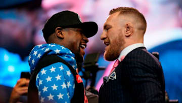 LOS ANGELES, CA - JULY 11: (L-R) Floyd Mayweather Jr. and Conor McGregor face off during the Floyd Mayweather Jr. v Conor McGregor World Press Tour event at the Staples Center on July 11, 2017 in Los Angeles, California. (Photo by Jeff Bottari/Zuffa LLC/Zuffa LLC via Getty Images)