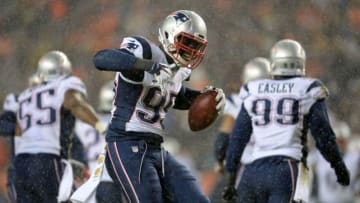 Nov 29, 2015; Denver, CO, USA; New England Patriots defensive end Chandler Jones (95) dances following his interception of Denver Broncos quarterback Brock Osweiler (17) (not pictured) in the second quarter at Sports Authority Field at Mile High. Mandatory Credit: Ron Chenoy-USA TODAY Sports