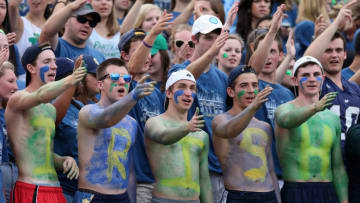 SOUTH BEND, IN - AUGUST 30: Student fans of the Notre Dame Fighting Irish cheer during a game against the Rice Owls at Notre Dame Stadium on August 30, 2014 in South Bend, Indiana. (Photo by Jonathan Daniel/Getty Images)