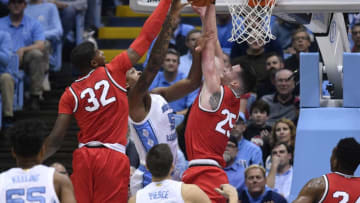 CHAPEL HILL, NORTH CAROLINA - DECEMBER 04: E.J. Liddell #32 and Kyle Young #25 of the Ohio State Buckeyes block a shot by Armando Bacot #5 of the North Carolina Tar Heels during the first half of their game at the Dean Smith Center on December 04, 2019 in Chapel Hill, North Carolina. (Photo by Grant Halverson/Getty Images)
