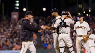 Jun 7, 2016; San Francisco, CA, USA; San Francisco Giants starting pitcher Albert Suarez (56) is removed from the game in the seventh innings by San Francisco Giants manager Bruce Bochy (15) against the Boston Red Sox at AT&T Park. Mandatory Credit: John Hefti-USA TODAY Sports