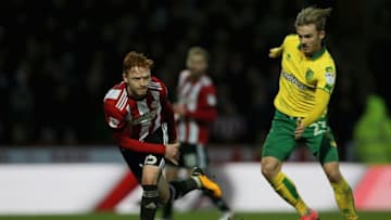BRENTFORD, ENGLAND - JANUARY 27: Ryan Woods of Brentford in action under pressure from James Maddison of Norwich City during the Sky Bet Championship match between Brentford and Norwich City at Griffin Park on January 27, 2018 in Brentford, England. (Photo by Harry Murphy/Getty Images)