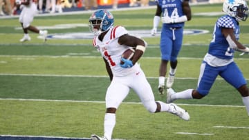 LEXINGTON, KENTUCKY - OCTOBER 03: Jonathan Mingo #1 of the Ole Miss Rebels runs for a touchdown during the 42-41 OT win over the Kentucky Wildcats at Commonwealth Stadium on October 03, 2020 in Lexington, Kentucky. (Photo by Andy Lyons/Getty Images)