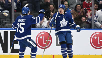 Sep 28, 2022; Toronto, Ontario, CAN; Toronto Maple Leafs forward Nick Robertson (89) celebrates with forward Alexander Kerfoot (15) after scoring against the Montreal Canadiens in the first period at Scotiabank Arena. Mandatory Credit: Dan Hamilton-USA TODAY Sports