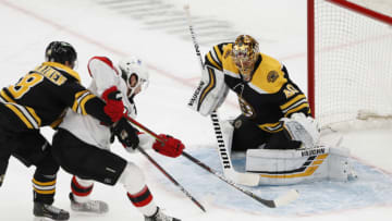 Mar 7, 2021; Boston, Massachusetts, USA; New Jersey Devils center Pavel Zacha (37) tries to control the puck in front of Boston Bruins goaltender Tuukka Rask (40) during the second period at TD Garden. Mandatory Credit: Winslow Townson-USA TODAY Sports