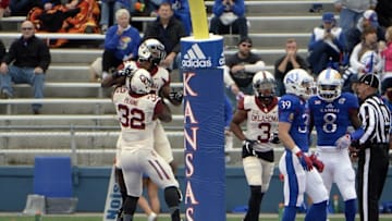 Oct 31, 2015; Lawrence, KS, USA; Oklahoma Sooners running back Joe Mixon (25) celebrates with running back Samaje Perine (32) after scoring a touchdown against the Kansas Jayhawks in the first half at Memorial Stadium. Mandatory Credit: John Rieger-USA TODAY Sports
