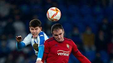 LA CORUNA, SPAIN - DECEMBER 16: Trilli of Deportivo de La Coruna competes for the ball with Kike Garcia of CA Osasuna during the Copa Del Rey second round match between RC Deportivo La Coruna and CA Osasuna at Estadio Abanca Riazor on December 16, 2021 in La Coruna, Spain. (Photo by Jose Manuel Alvarez/Quality Sport Images/Getty Images)