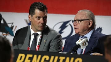 CHICAGO, IL - JUNE 24: General manager Jim Rutherford, right, and Bill Guerin of the Pittsburgh Penguins talk at the draft table during the 2017 NHL Draft at United Center on June 24, 2017 in Chicago, Illinois. (Photo by Dave Sandford/NHLI via Getty Images)