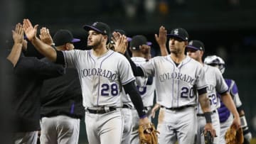 SEATTLE, WA - JULY 06: Nolan Arenado #28 of the Colorado Rockies and Ian Desmond #20 of the Colorado Rockies greet their teammates as they celebrate their win against the Seattle Mariners at Safeco Field on July 6, 2018 in Seattle, Washington. (Photo by Lindsey Wasson/Getty Images)
