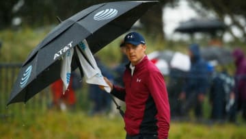 SOUTHPORT, ENGLAND - JULY 21: Jordan Spieth of the United States shelters from the rain under an umbrella during the second round of the 146th Open Championship at Royal Birkdale on July 21, 2017 in Southport, England. (Photo by Gregory Shamus/Getty Images)