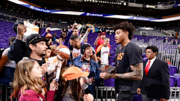 PHOENIX, AZ - DECEMBER 28: Kelly Oubre Jr. #3 of the Phoenix Suns signs autographs for fans prior to the game against the Oklahoma City Thunder on December 28, 2018 at Talking Stick Resort Arena in Phoenix, Arizona. NOTE TO USER: User expressly acknowledges and agrees that, by downloading and or using this photograph, user is consenting to the terms and conditions of the Getty Images License Agreement. Mandatory Copyright Notice: Copyright 2018 NBAE (Photo by Barry GossageNBAE via Getty Images)