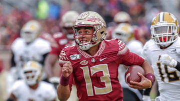 TALLAHASSEE, FL - NOVEMBER 16: Quarterback Jordan Travis #13 of the Florida State Seminoles on a quarterback sneak play during the game against the Alabama State Hornets at Doak Campbell Stadium on Bobby Bowden Field on November 16, 2019 in Tallahassee, Florida. The Seminoles defeated The Hornets 49 to 12. (Photo by Don Juan Moore/Getty Images)