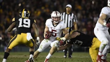 Jan 1, 2016; Pasadena, CA, USA; Stanford Cardinal running back Christian McCaffrey (5) runs against Iowa Hawkeyes linebacker Josey Jewell (43) and defensive back Miles Taylor (19) during the fourth quarter in the 2016 Rose Bowl at Rose Bowl. Mandatory Credit: Richard Mackson-USA TODAY Sports