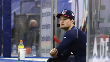 NEW YORK, NEW YORK - FEBRUARY 08: Alexis Lafreniere #13 of the New York Rangers sits on the bench prior to warm-ups before the game against the New York Islanders at Madison Square Garden on February 08, 2021 in New York City. (Photo by Bruce Bennett/Getty Images)