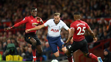 MANCHESTER, ENGLAND - AUGUST 27: Harry Kane of Tottenham Hotspur battles for possession with Paul Pogba of Manchester United and Antonio Valencia of Manchester United during the Premier League match between Manchester United and Tottenham Hotspur at Old Trafford on August 27, 2018 in Manchester, United Kingdom. (Photo by Michael Regan/Getty Images)