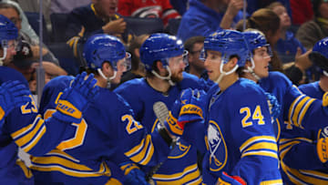 Oct 4, 2022; Buffalo, New York, USA; Buffalo Sabres center Dylan Cozens (24) celebrates his goal with teammates during the first period against the Carolina Hurricanes at KeyBank Center. Mandatory Credit: Timothy T. Ludwig-USA TODAY Sports