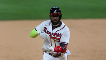 ARLINGTON, TEXAS - OCTOBER 15: Marcell Ozuna #20 of the Atlanta Braves celebrates after hitting a solo home run against the Los Angeles Dodgers during the seventh inning in Game Four of the National League Championship Series at Globe Life Field on October 15, 2020 in Arlington, Texas. (Photo by Ronald Martinez/Getty Images)