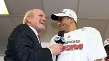 Jan 20, 2013; Atlanta, GA, USA; San Francisco 49ers quarterback Colin Kaepernick (7) talks with Fox broadcaster Terry Bradshaw after winning the NFC Championship game against the Atlanta Falcons at the Georgia Dome. The 49ers won 28-24. Mandatory Credit: Matthew Emmons-USA TODAY Sports