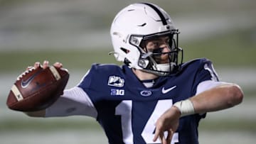 Dec 19, 2020; University Park, Pennsylvania, USA; Penn State Nittany Lions quarterback Sean Clifford (14) warms up on the sideline during the fourth quarter against the Illinois Fighting Illini at Beaver Stadium. Penn State defeated Illinois 56-21. Mandatory Credit: Matthew OHaren-USA TODAY Sports