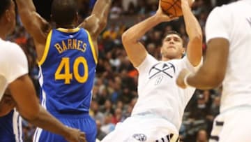 Nov 22, 2015; Denver, CO, USA; Denver Nuggets forward Danilo Gallinari (8) shoots the ball against Golden State Warriors forward Harrison Barnes (40) at Pepsi Center. Mandatory Credit: Chris Humphreys-USA TODAY Sports