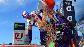 AVONDALE, ARIZONA - NOVEMBER 10: Denny Hamlin, driver of the #11 FedEx Ground Toyota, celebrates in Victory Lane after winning the Monster Energy NASCAR Cup Series Bluegreen Vacations 500 at ISM Raceway on November 10, 2019 in Avondale, Arizona. (Photo by Jared C. Tilton/Getty Images)
