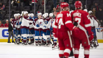 Feb 23, 2022; Detroit, Michigan, USA; Colorado Avalanche right wing Nicolas Aube-Kubel (16) celebrates with teammates as the Detroit Red Wings leave the ice just after the game at Little Caesars Arena. Mandatory Credit: Raj Mehta-USA TODAY Sports