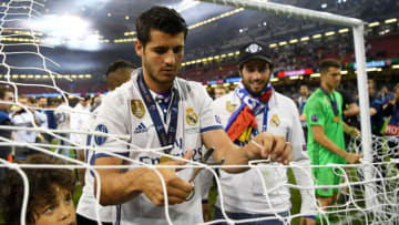 CARDIFF, WALES - JUNE 03: Alvaro Morata of Real Madrid cuts the net after the UEFA Champions League Final between Juventus and Real Madrid at National Stadium of Wales on June 3, 2017 in Cardiff, Wales. (Photo by Shaun Botterill/Getty Images)