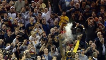 Oct 30, 2014; Cleveland, OH, USA; Cleveland Cavaliers forward LeBron James throws chalk in the air during his pregame ritual prior to the game against the New York Knicks at Quicken Loans Arena. Mandatory Credit: David Richard-USA TODAY Sports