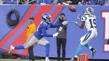 Dec 20, 2015; East Rutherford, NJ, USA; Carolina Panthers wide receiver Ted Ginn (19) cannot catch a pass during the third quarter defended by New York Giants cornerback Prince Amukamara (20) at MetLife Stadium. Carolina Panthers defeat the New York Giants 38-35. Mandatory Credit: Jim O
