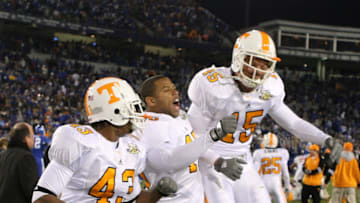 LEXINGTON, KY - NOVEMBER 24: Savion Frazier #43, Kevin Cooper #45 and Sinclair Cannon #15 of the Tennessee Volunteers celebrate after the 52-50 four overtime victory over the Kentucky Wildcats at Commonwealth Stadium November 24, 2007 in Lexington, Kentucky. (Photo by Andy Lyons/Getty Images)